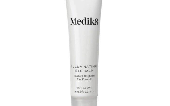 Medik8 Illuminating Eye Balm tube for brightening and skincare.