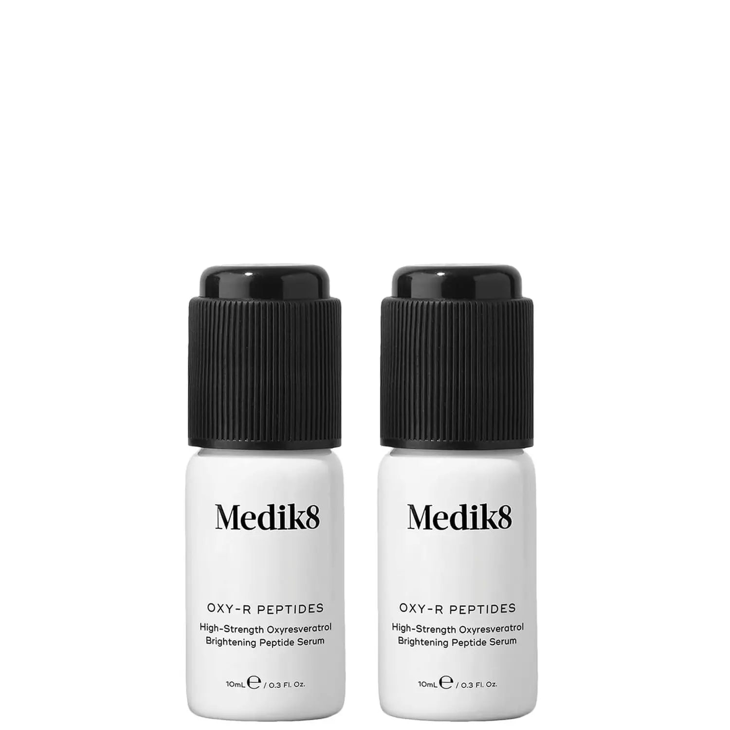 Two Medik8 OXY-R Peptides brightening serum bottles.
