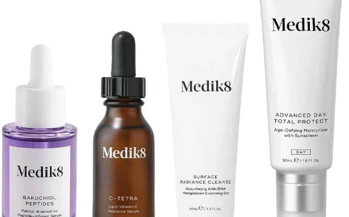 Medik8 skincare products including serums, cleanser, and moisturizer.