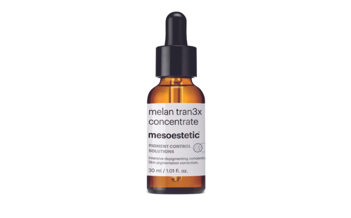 Mesoestetic Melan Tran3x Concentrate bottle on white background.