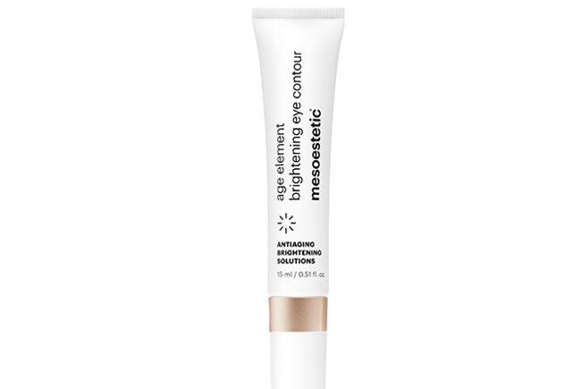 Brightening eye contour cream tube on white background.